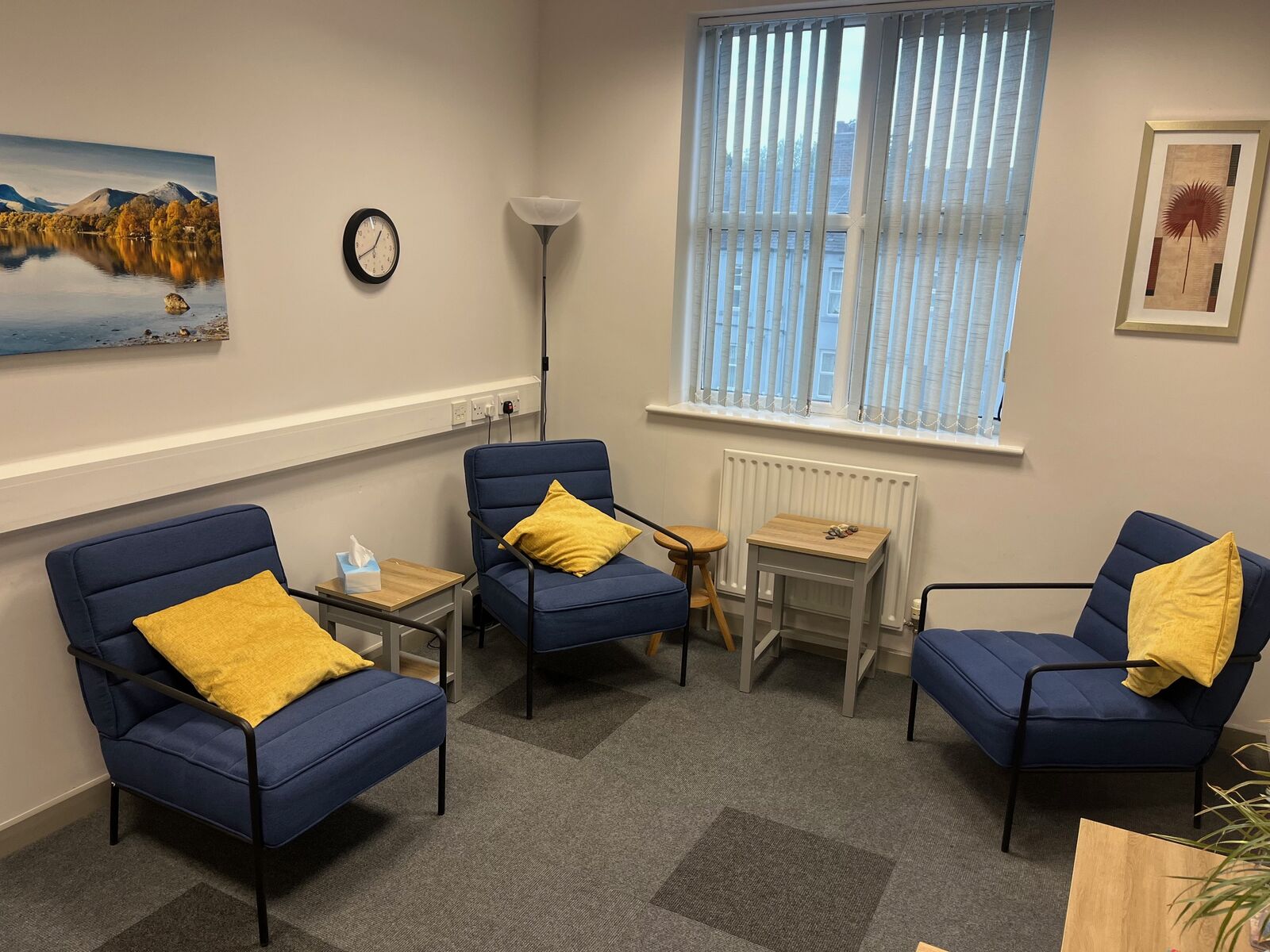 Inside the counselling room at Bourne House, with a Lake District canvas on the wall